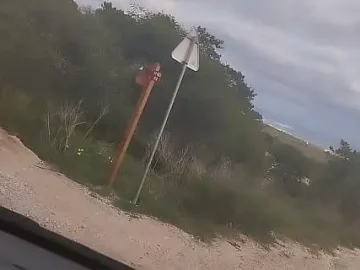 guy of car spills a lot of milk on a trail near the sea 1733437369